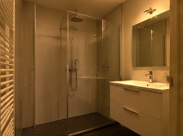 Bathroom before editing, dark with a yellow colour cast